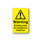 Yellow warning building sites sticker with black triangle, exclamation mark and text
