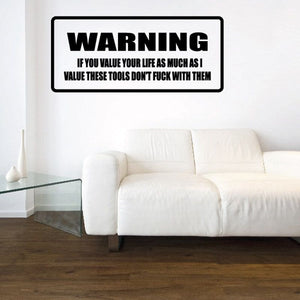 Warning decal with bold “WARNING” header and smaller instruction text in black on white