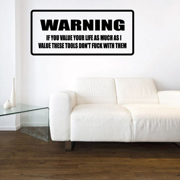 Warning decal with bold “WARNING” header and smaller instruction text in black on white