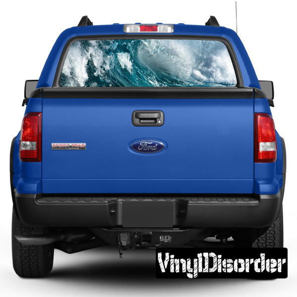 Blue car rear hatch with waves graphic visible through rear window