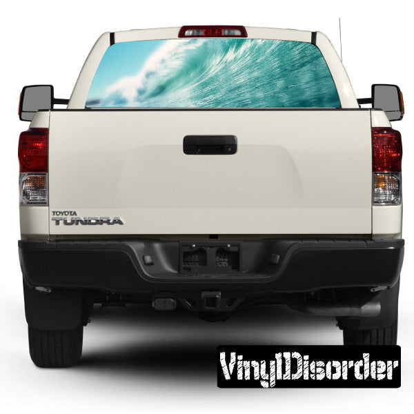 Truck rear window graphic with teal wave design
