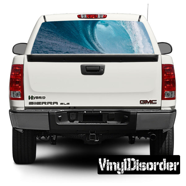 Rear window graphic decal with blue wave pattern on a vehicle trunk