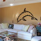 Dolphin wall decal with wavy pattern, black silhouette.