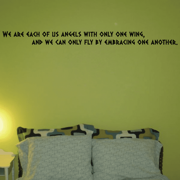 Wall decal with black quote lettering across the top of a wall