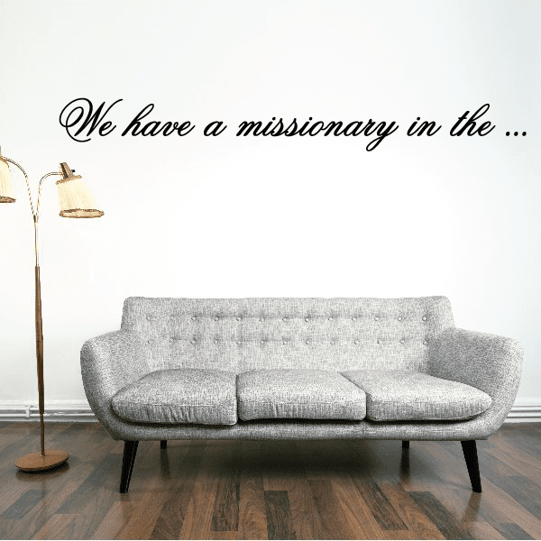 Script wall decal with wording "We have a missionary in the..." in black