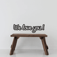 Wall decal with black script text: We love you!