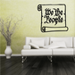 Black scroll wall decal with “We the People” lettering