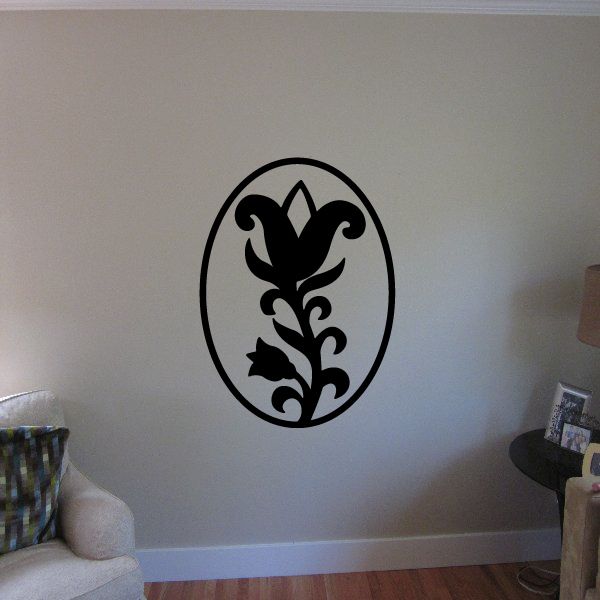 Lily flower weather vane decal in black oval outline with decorative silhouette