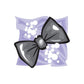 Wedding bow tie sticker with black and gray bow on purple floral pattern