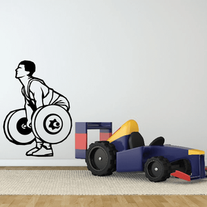 Weight lifting wall decal with black silhouette of lifter holding a barbell