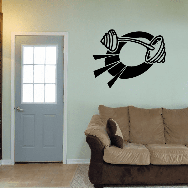 Black wall decal featuring a dumbbell with radiating rays and a central circle