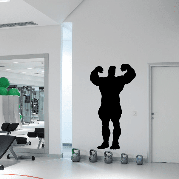 Weightlifting wall decal of a black silhouetted lifter holding overhead weights