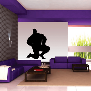 Weightlifting wall decal with black weightlifter silhouette kneeling and lifting