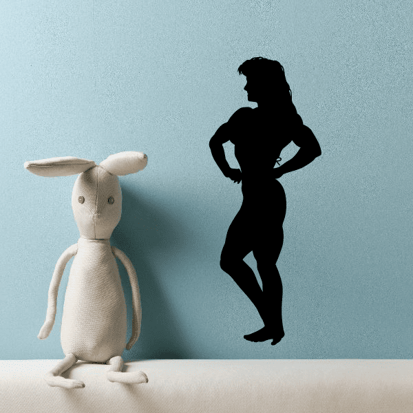 Black weightlifting wall decal of a woman in lunge pose