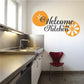 Kitchen wall decal with Welcome to our Kitchen text and orange floral accents