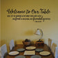 Wall decal reading "Welcome To Our Table" with a friendship quote