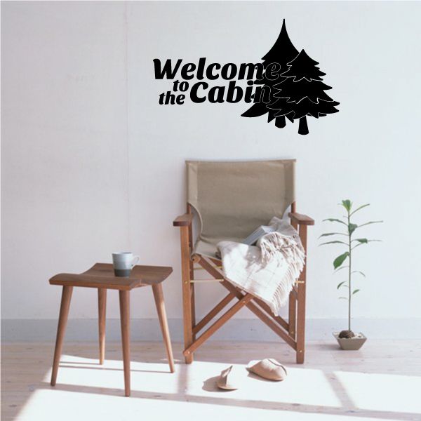 Cabin wall decal with “Welcome to the Cabin” text and pine tree silhouette