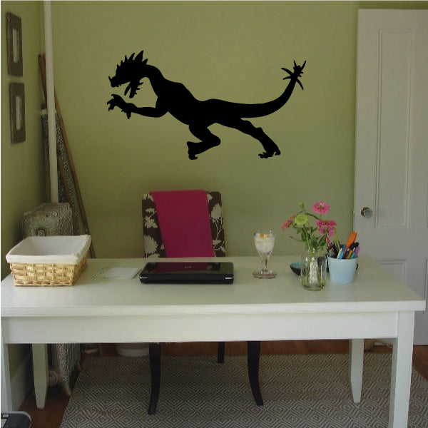 Black flying dragon wall decal with wings spread and tail curled