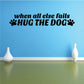 Wall decal: 'When all else fails hug the dog' with paw print icons