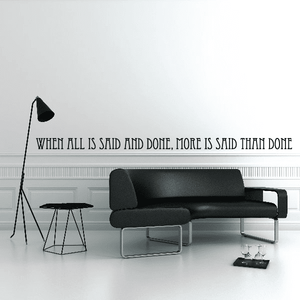 Wall quote decal reading “When all is said and done, more is said than done”