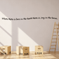Wall decal with cursive quote text in dark lettering