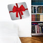 White present sticker with large red bow on ribbon