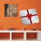 White gift sticker with red bow and ribbon