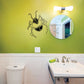 Roach wall decal with black outline on green wall