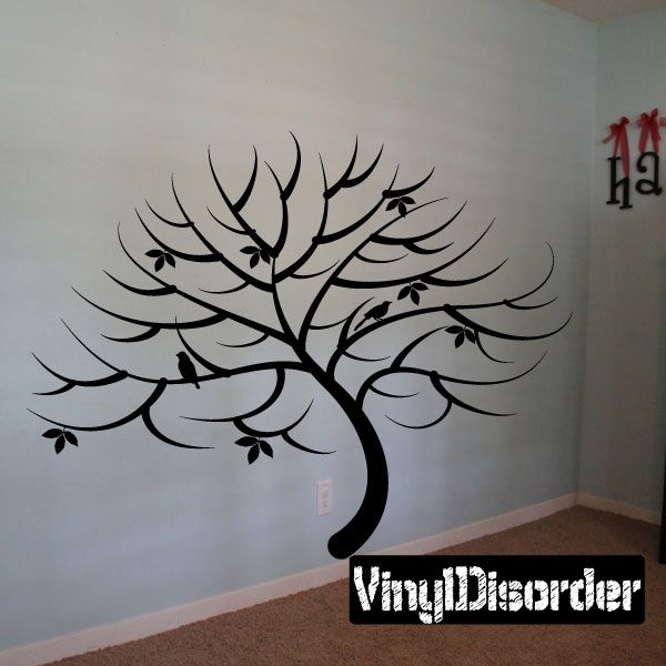 Tree wall decal with wide bare branches, leaves, and small birds