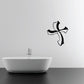 Black wiggly cross wall decal with ribbon-like ends