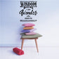 Socrates wall decal reading "Wisdom Begins in Wonder" above stacked cushions