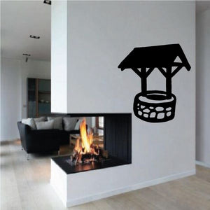 Wishing well vinyl wall decal featuring a black well with bucket