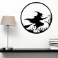 Black circular wall decal with witch silhouette flying on broom among trees