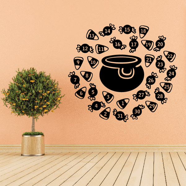 Halloween game decal with black cauldron, numbered candy corn pieces, and small bones