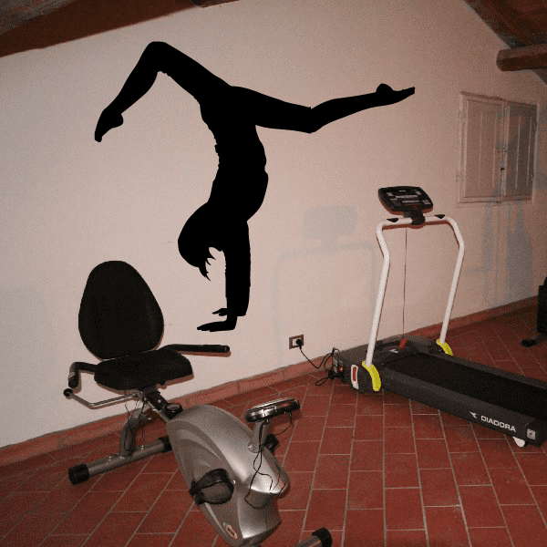 Wall handstand decal with black silhouette of a person performing a handstand pose.