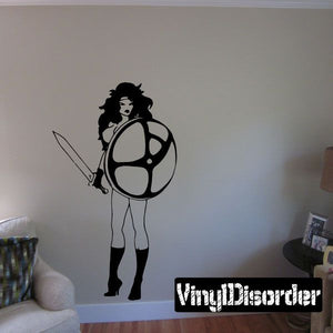 Woman silhouette wall decal with shield emblem and high heels