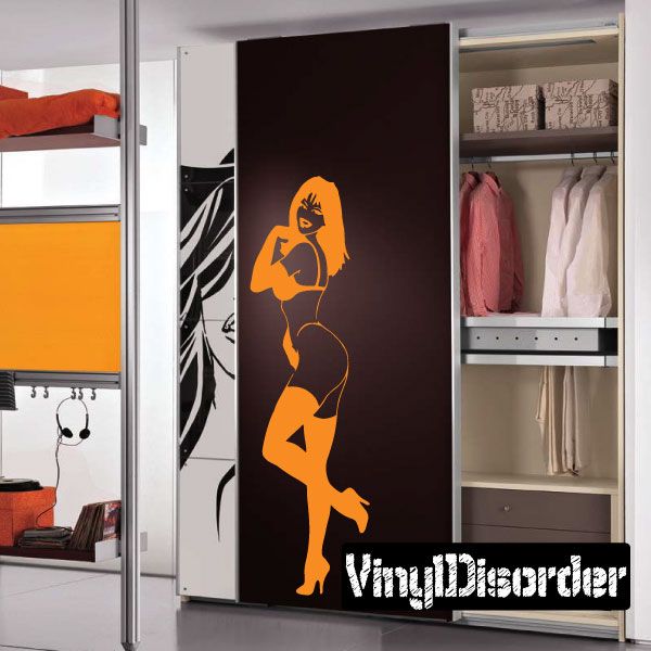 Woman lingerie heels decal, orange silhouette on dark surface