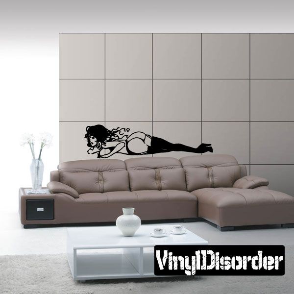 Black vinyl wall decal of a woman lying down with boots, full-body silhouette