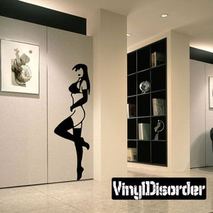 Wall decal of a woman on tiptoes in lingerie, black silhouette