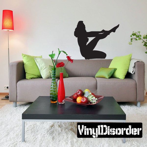 Black vinyl wall decal silhouette of a woman putting on nylons