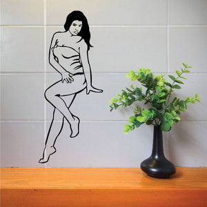 Black outline decal of a seated woman in a short dress, one hand on her lap
