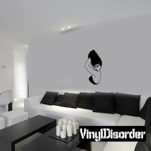 Wall vinyl decal featuring a woman posing with hands in her hair