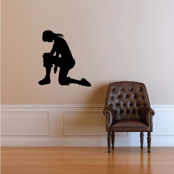 Praying woman silhouette wall decal, black woman with hands down and kneeling posture