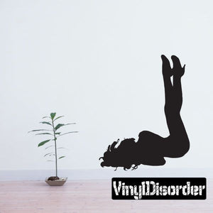 Black woman silhouette wall decal with legs in the air, lying down