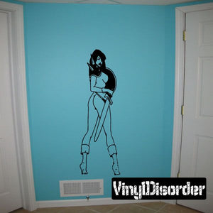 Woman with spiked shoulder guards wall decal, stylized black-and-white figure