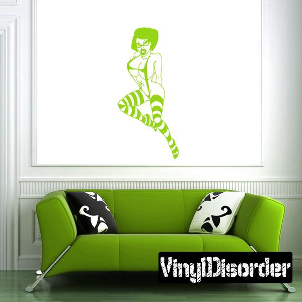 Green woman decal with glasses and striped stockings, sitting pose