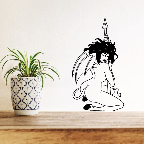 Women silhouette wall decal of seated winged woman holding spear