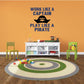 Pirate-themed wall decal with skull icon and text: Work like a Captain, Play like a Pirate
