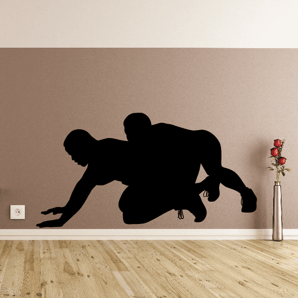 Wrestling decal of two silhouetted wrestlers in black