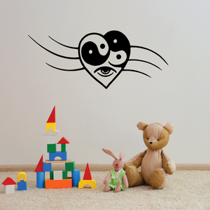 Yin-yang heart wall decal with black eye faces and swirl accents